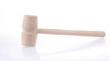 Wooden mallets help coppersmiths create the basic forms of their work.