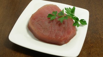 Served raw or lightly seared, Ahi tuna steaks are not usually cooked throughout.