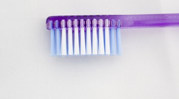 Make sure to choose a soft-bristle tooth brush to prevent damaging the partial.