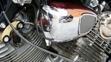 Young woman checking engine of car