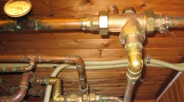 Old copper pipes can be a source of mineral deposits on shower heads.