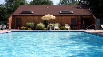 view of a swimming pool in the backyard of a house