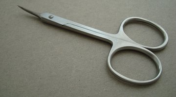 Cosmetic scissors with blades under four inches are allowed.
