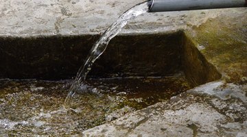 Some water pumps are attached to a drainage pipe.