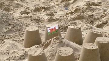 Use old flower pots for sand play.