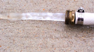 Locate the source of the leak with a garden hose.