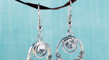 Earrings adorned with iolite are an appropriate gift idea for a 21st anniversary.