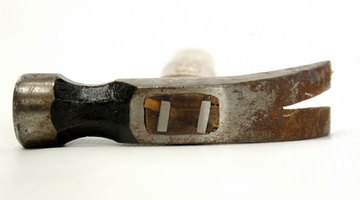 Metal wedges help to secure the wooden handle to the head.
