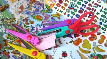 Craft, stickers and scrapbooking supplies are used to make cards.