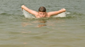 Both arms must be used simultaneously in the butterfly.