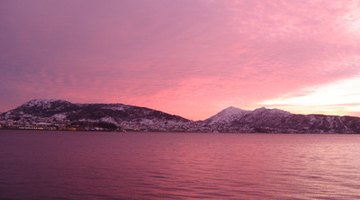 The water captures the colors of the sky.