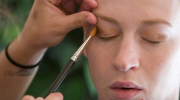 Use an eyeshadow sponge to apply glue.