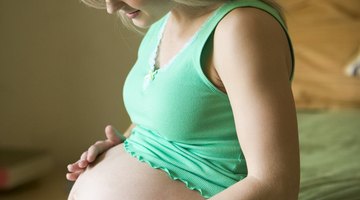 Side view of mother raising baby in air