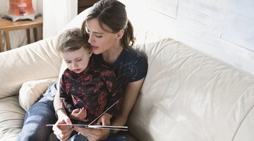 Mother Reading Picture Book for Daughter