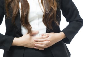 woman with back pain in the office