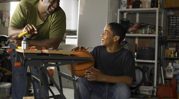 Father applying lather to boy's face