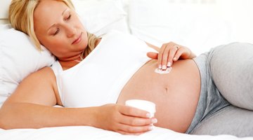 Pregnant woman stroking her belly