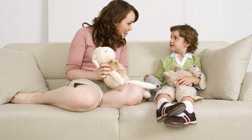 mother with boy lies on meadow