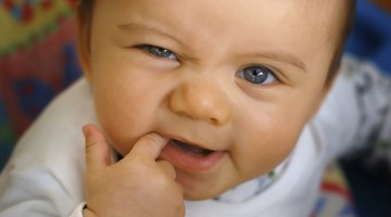 A baby with fingers in mouth