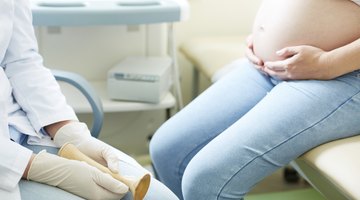 Pregnant woman with her husband and son