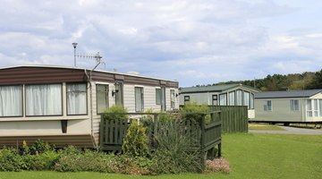 Mobile home with lush patio area