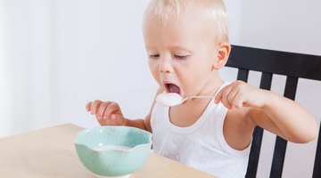 Baby eating rice cakes