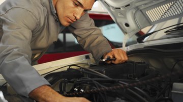 Auto mechanic fixing vehicle