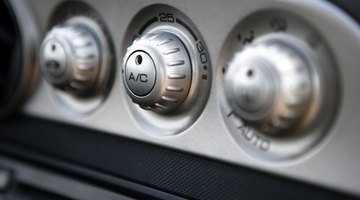 Knobs and controls on dashboard of automobile
