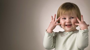 Boy with hands on head