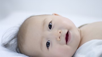 Newborn baby lying on a white background