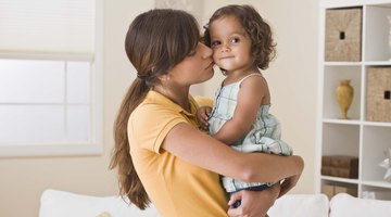 Mother makes healthy massage for baby