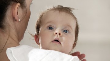 Newborn baby gets breastfeeding