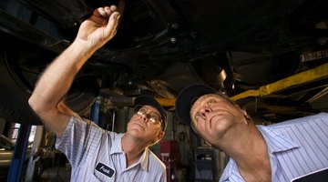 Father and son repairing car