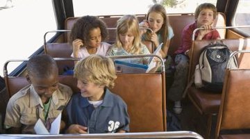 Children can read or study on the bus, but not while walking to school.