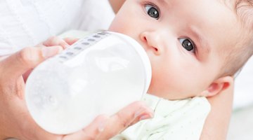 Baby drinking milk from bottle
