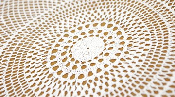 Large lace doily on top of dresser