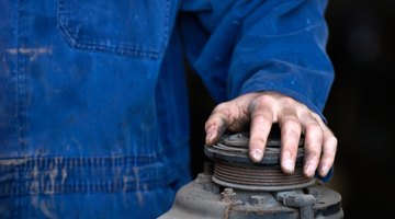 Mechanics under car on lift