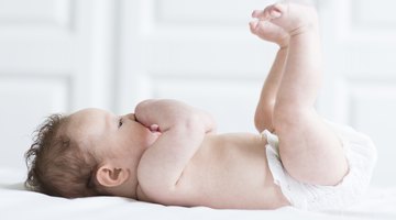 Infant baby been examined on the balance