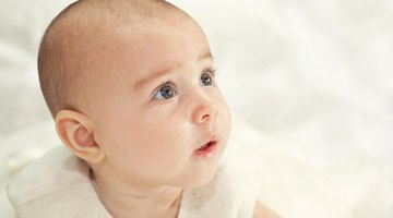 close-up portrait of a beautiful sleeping baby on white