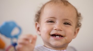 Baby Chewing on Crib