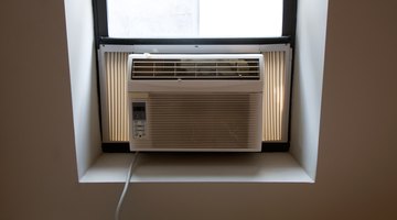 Salesgirl showing air conditioner to man in supermarket