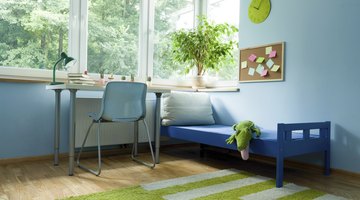 A calm child's room with blue and green accents.