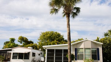 Two typical Florida mobile homes with screened in patio areas