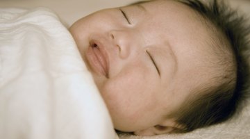 Newborn baby boy (0-3 months) sleeping