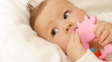 Infant with teething toy