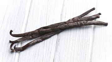 Closeup root and candied ginger on wooden table