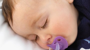 Baby sleeping peacefully with pacifier