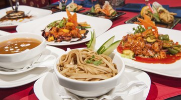 Three People Enjoying a Meal in a Chinese Restaurant