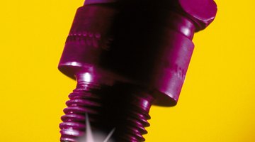 Close-up of a spark plug with sparks exploding