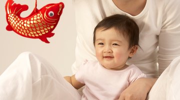 Asian mother smiling at baby